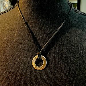 Peace-Joy-Faith- round silver plated charm on a black silk necklace